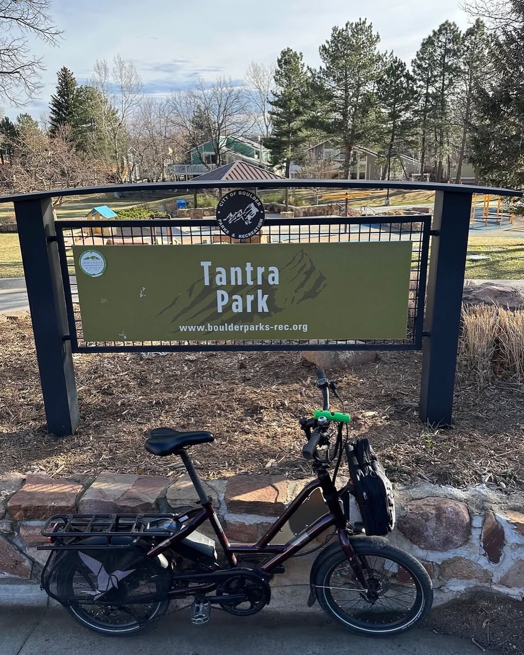 A compact cargo bike parked at Tantra Park in Boulder
