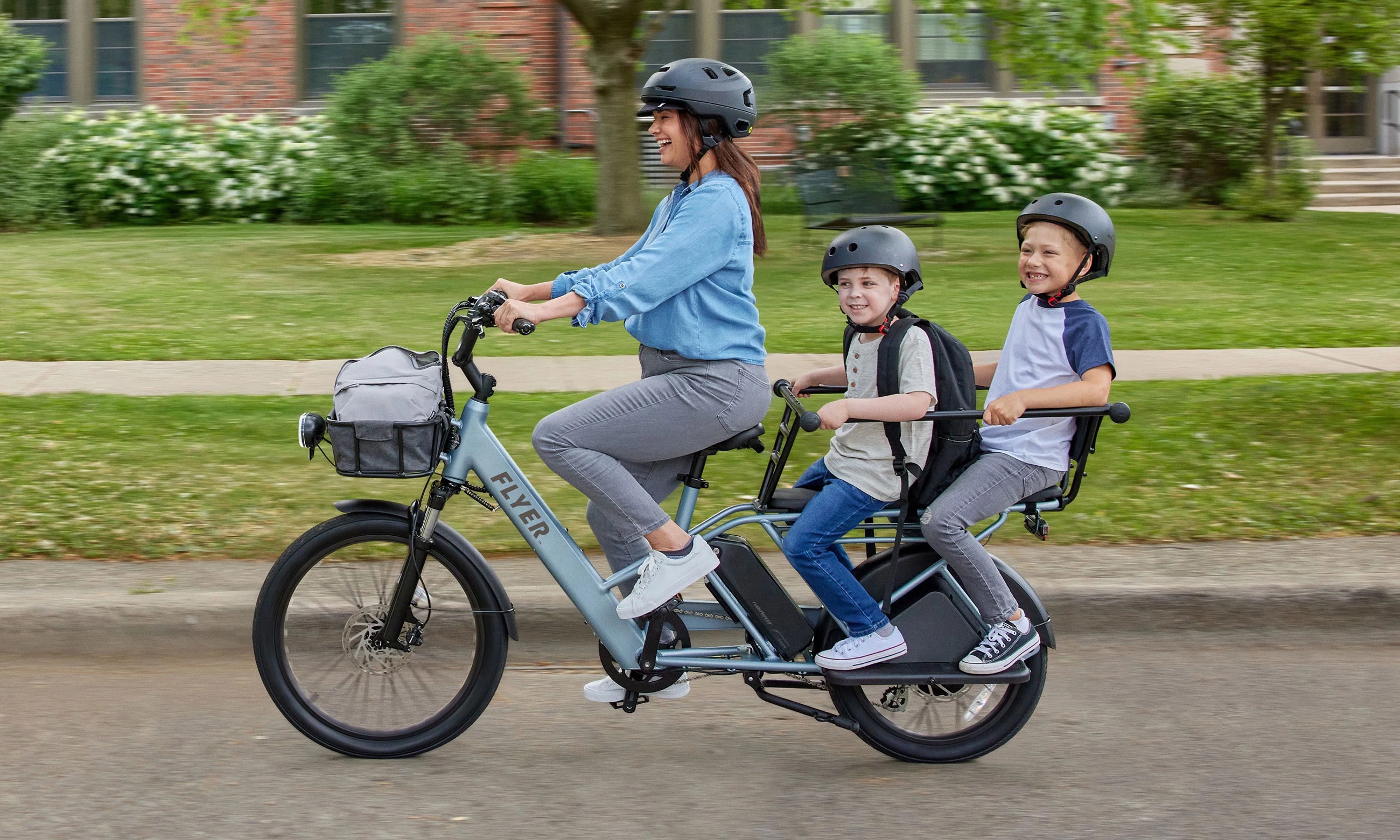 An electric cargo bike on a park path