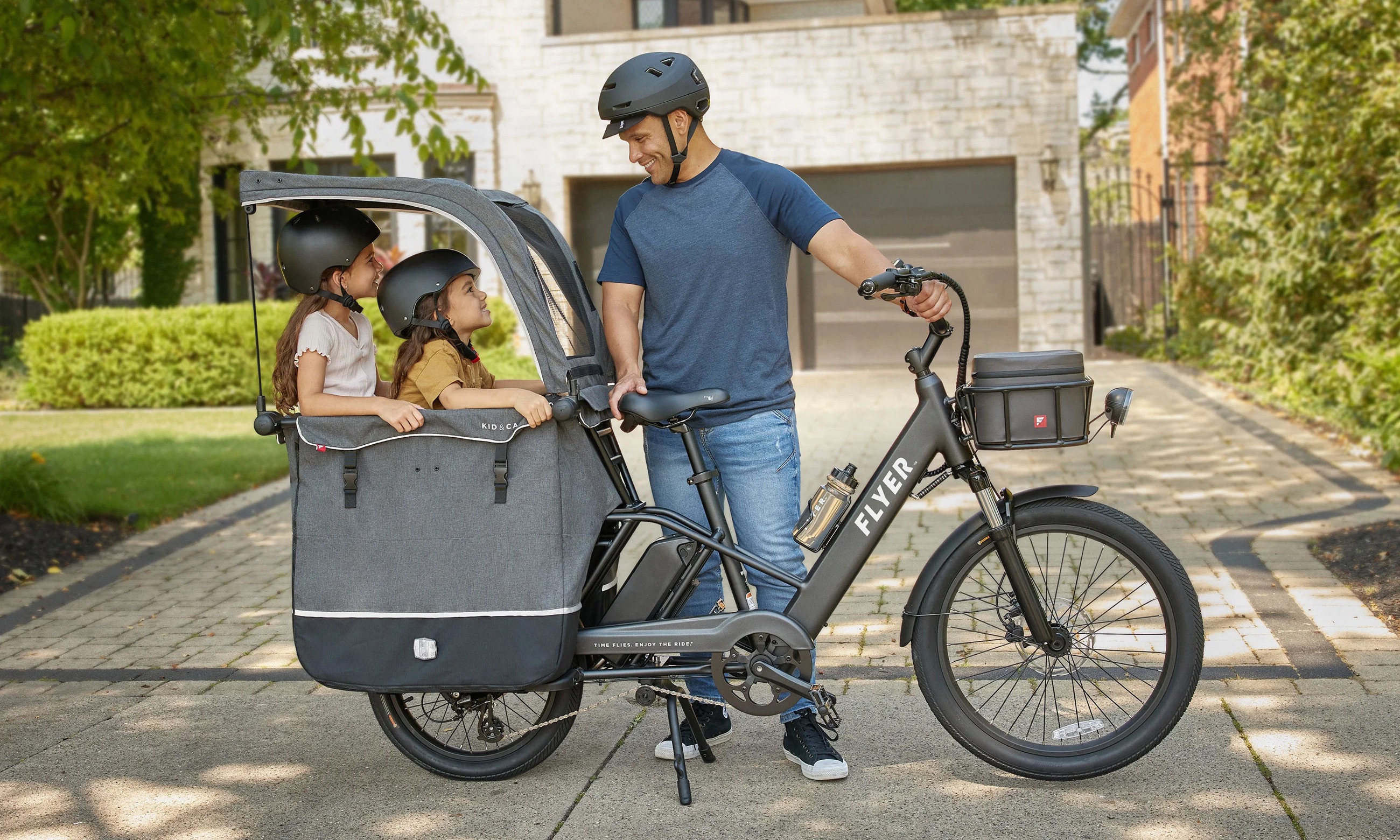 A family riding an electric cargo bike